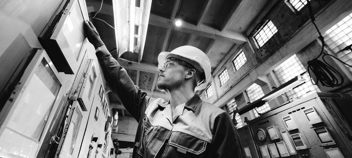 A mechanic looking a